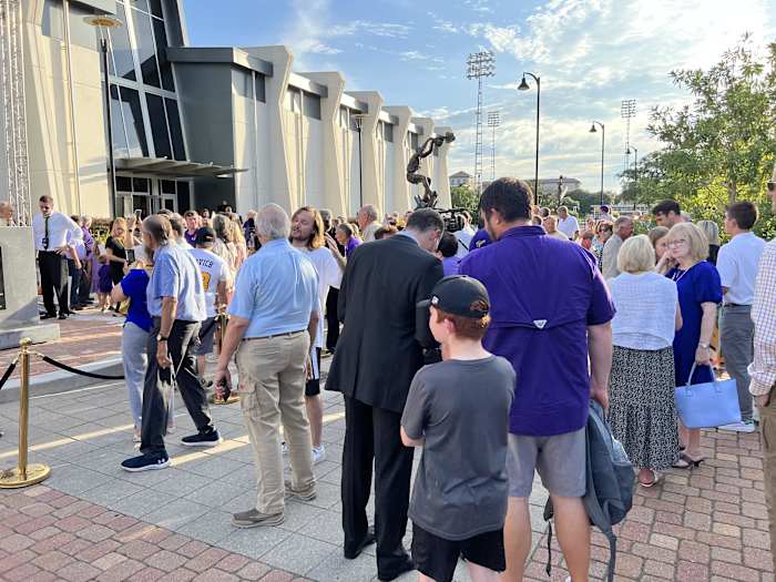 LSU Men's Basketball Head Coach Matt McMahon, pictured in the suit, signs autographs and takes pictures with fans following the unveiling of Pete Maravich's statue on July 25, 2022.